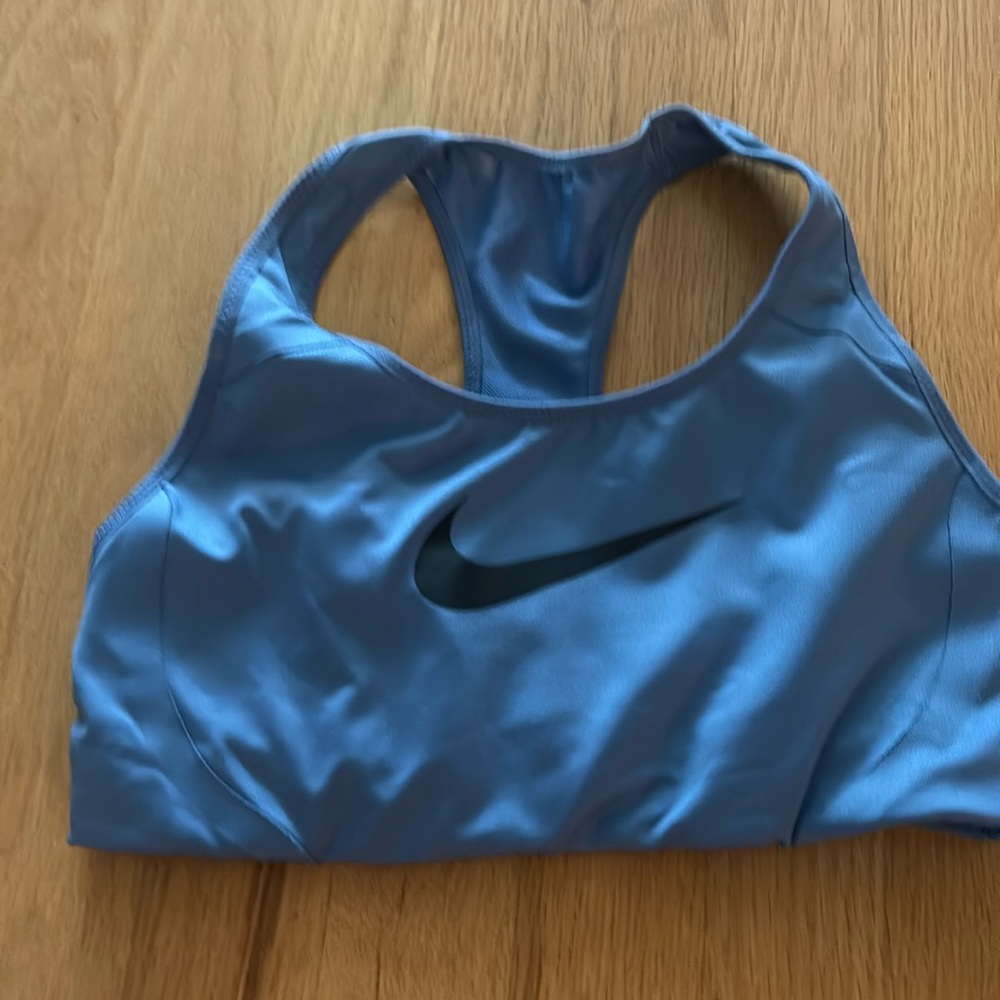 A dusty blue shade Nike sports bra. Size small. Excellent used condition